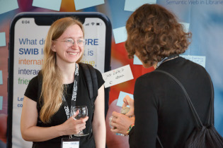 Participants in discussion during coffee break 1