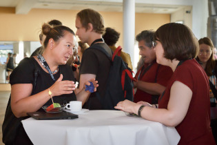 Participants in discussion during coffee break 2