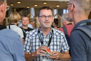 Participants in discussion during coffee break 3